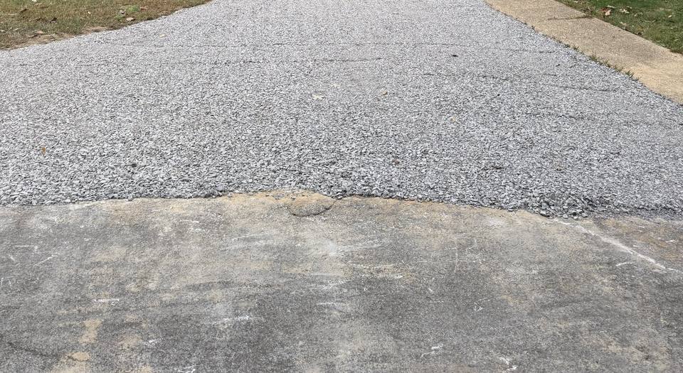 After: the drive extended with fresh gravel