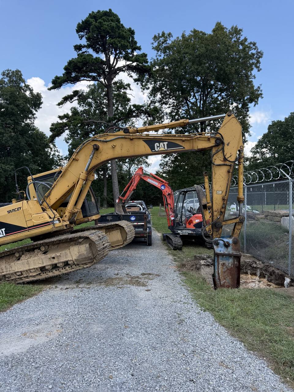 Two excavators digging on one site