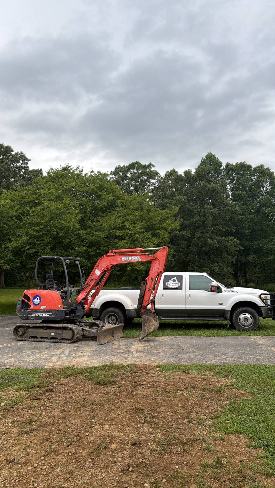 Excavator and truck on a cleared site