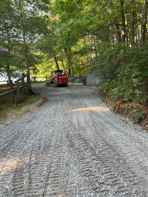 Fresh gravel drive with the track loader at the far end