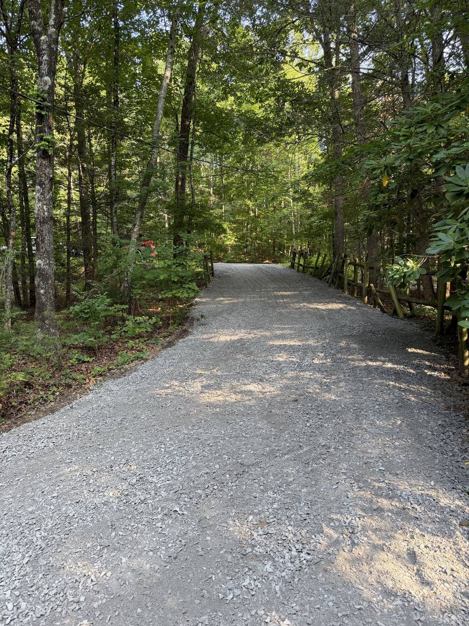 After: the same drive with fresh gravel